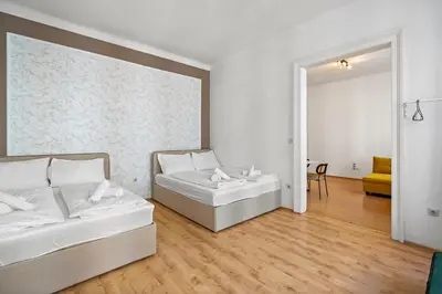 Ein Bett oder Betten in einem Zimmer der Unterkunft Apartments Maximilian