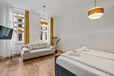 Ein Bett oder Betten in einem Zimmer der Unterkunft Apartments Maximilian