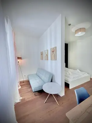 Ein Sitzbereich in der Unterkunft Apartments Maximilian