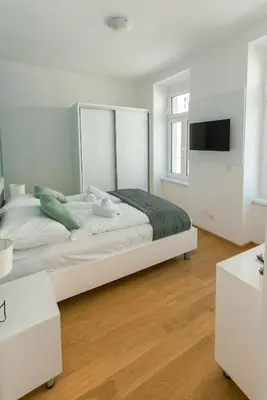 Ein Bett oder Betten in einem Zimmer der Unterkunft New Design Apartment 9