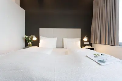 Ein Bett oder Betten in einem Zimmer der Unterkunft Penthouse Loft with Skyline-View