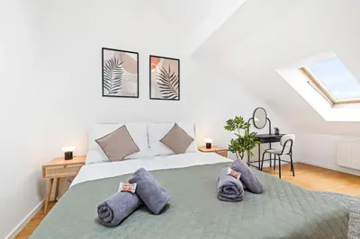 Ein Bett oder Betten in einem Zimmer der Unterkunft Modern Apartment near City Center - Rooftop Terrace