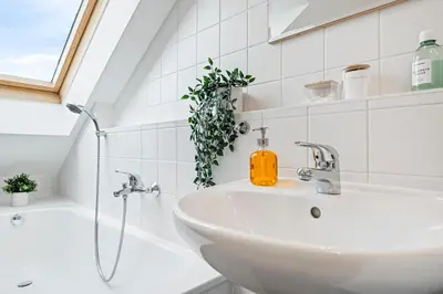 Ein Badezimmer in der Unterkunft Modern Apartment near City Center - Rooftop Terrace