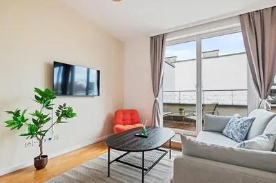 TV/Unterhaltungsangebot in der Unterkunft Modern Apartment near City Center - Rooftop Terrace