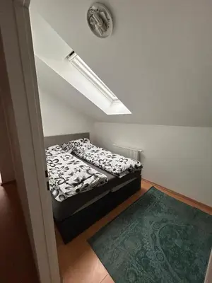 Ein Bett oder Betten in einem Zimmer der Unterkunft Gemütliche Unterkunft in Pottendorf