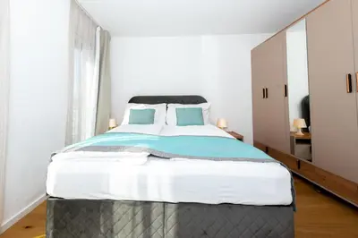 Ein Bett oder Betten in einem Zimmer der Unterkunft Retsina Apartments