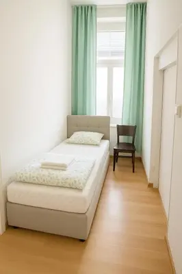 Ein Bett oder Betten in einem Zimmer der Unterkunft City Rooms