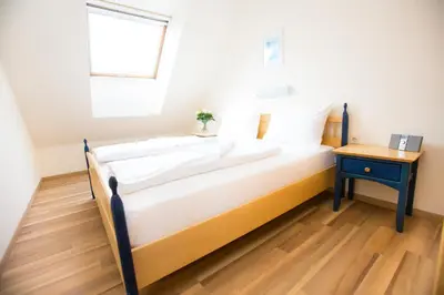 Ein Bett oder Betten in einem Zimmer der Unterkunft Donauauen Apartments