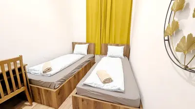 Ein Bett oder Betten in einem Zimmer der Unterkunft Spacious Rooms - 15 Min from Airport & City Center, 5 Min from Vienna Main-Bus Station EZ1