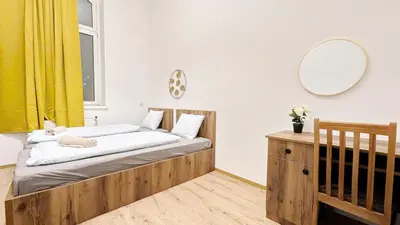 Ein Bett oder Betten in einem Zimmer der Unterkunft Spacious Rooms - 15 Min from Airport & City Center, 5 Min from Vienna Main-Bus Station EZ1