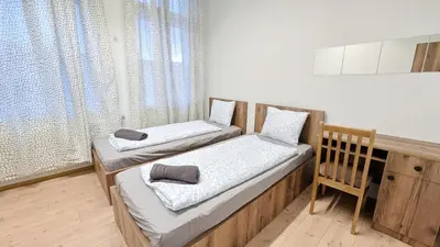 Ein Bett oder Betten in einem Zimmer der Unterkunft Spacious Rooms - 15 Min from Airport & City Center, 5 Min from Vienna Main-Bus Station EZ9