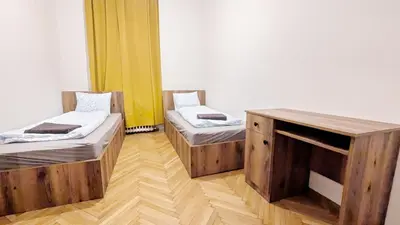 Ein Bett oder Betten in einem Zimmer der Unterkunft Spacious Rooms - 15 Min from Airport & City Center, 5 Min from Vienna Main-Bus Station EZ9
