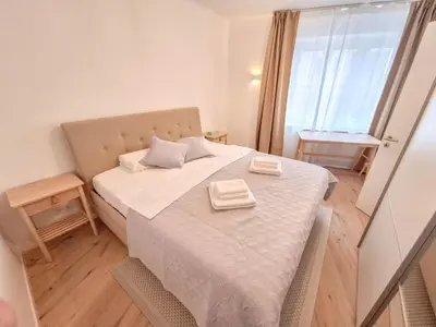 Ein Bett oder Betten in einem Zimmer der Unterkunft LuVi