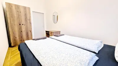 Ein Bett oder Betten in einem Zimmer der Unterkunft Spacious Rooms - 15 Min from Airport & City Center, 5 Min from Vienna Main-Bus Station EZ 12