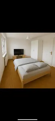 Ein Bett oder Betten in einem Zimmer der Unterkunft Stadtwohnung mit großer Terasse