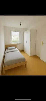Ein Bett oder Betten in einem Zimmer der Unterkunft Stadtwohnung mit großer Terasse