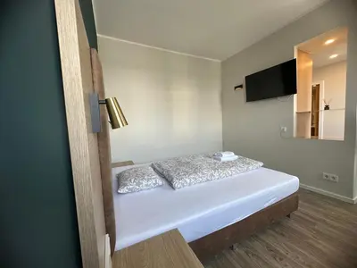 Ein Bett oder Betten in einem Zimmer der Unterkunft bookVienna 
