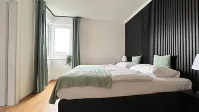 Ein Bett oder Betten in einem Zimmer der Unterkunft Moderne OG Wohnung inklusive Dachterrasse