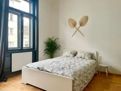 Ein Bett oder Betten in einem Zimmer der Unterkunft Stylish Flat in Heart of Vienna