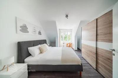 Ein Bett oder Betten in einem Zimmer der Unterkunft Quiet city oasis for up to 5 guests