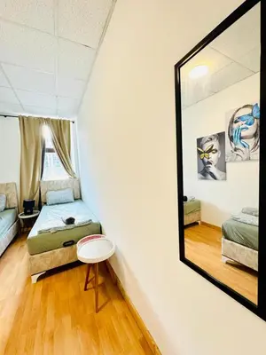 Ein Bett oder Betten in einem Zimmer der Unterkunft Simple Two Private Rooms with Shared Living Area in Vienna