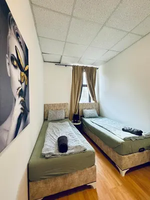 Ein Bett oder Betten in einem Zimmer der Unterkunft Simple Two Private Rooms with Shared Living Area in Vienna