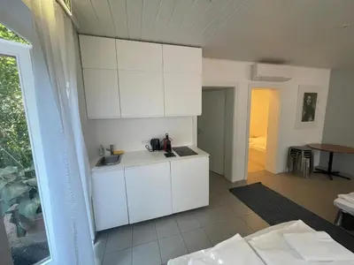 Ein Bett oder Betten in einem Zimmer der Unterkunft Storchencamp Gästehaus Purbach