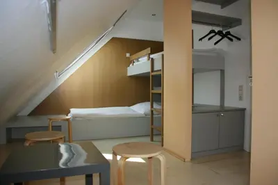 Ein Bett oder Betten in einem Zimmer der Unterkunft Storchencamp Gästehaus Purbach