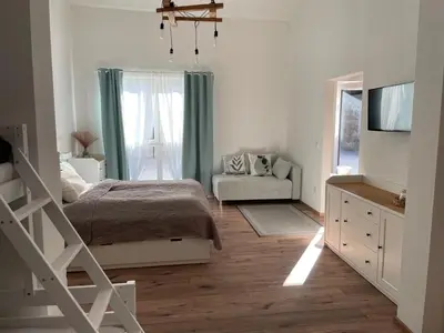 Ein Bett oder Betten in einem Zimmer der Unterkunft Ferienwohnung Wulkatal