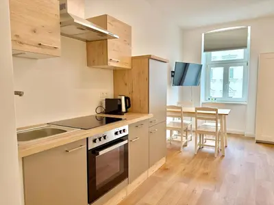 Küche/Küchenzeile in der Unterkunft Modern Renovated Apartment