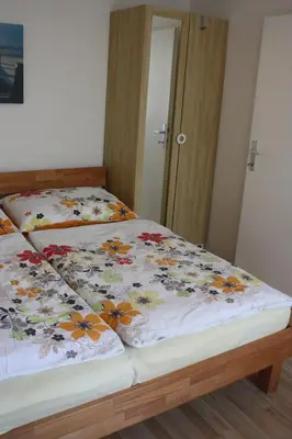 Ein Bett oder Betten in einem Zimmer der Unterkunft Ferienwohnung Heiling