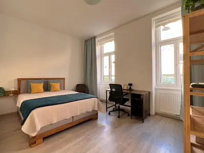 Ein Bett oder Betten in einem Zimmer der Unterkunft SERVUS HOMES - Metro Stadthalle - VIENNA CALLING