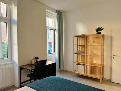 Ein Bett oder Betten in einem Zimmer der Unterkunft SERVUS HOMES - Metro Stadthalle - VIENNA CALLING