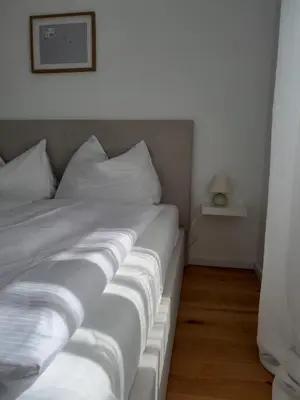 Ein Bett oder Betten in einem Zimmer der Unterkunft The Moment Luxury Suites