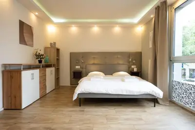 Ein Bett oder Betten in einem Zimmer der Unterkunft Studio with Queen-Size Bed K4
