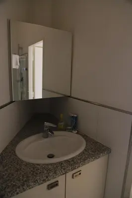 Ein Badezimmer in der Unterkunft City Central Suite