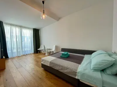 Ein Bett oder Betten in einem Zimmer der Unterkunft Bright loft 110 sqm with great roof terrace 100 sqm