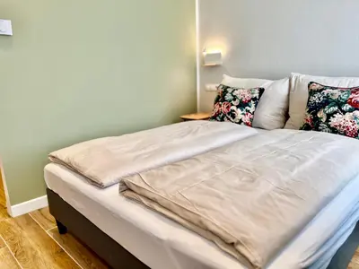 Ein Bett oder Betten in einem Zimmer der Unterkunft TheWICKI 2214 - Wunderschöne Apartments in Wien