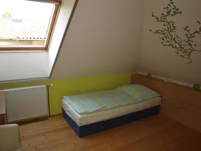 Ein Bett oder Betten in einem Zimmer der Unterkunft Ferienwohnung Heider