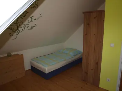Ein Bett oder Betten in einem Zimmer der Unterkunft Ferienwohnung Heider