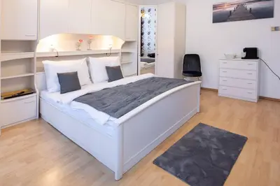 Ein Bett oder Betten in einem Zimmer der Unterkunft Premium Deluxe Zentrum nähe