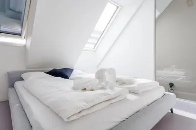 Ein Bett oder Betten in einem Zimmer der Unterkunft Julius 23 - Cozy Stay Only 5 Mins to City Center