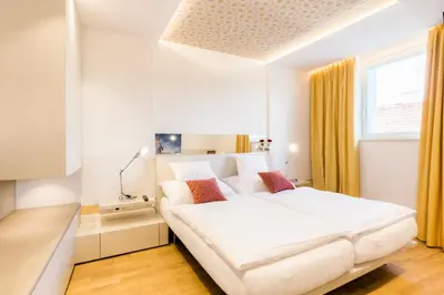 Ein Bett oder Betten in einem Zimmer der Unterkunft Vienna Grand Apartments DANUBE
