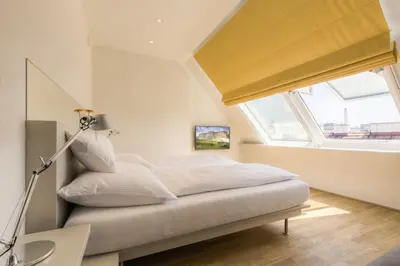 Ein Bett oder Betten in einem Zimmer der Unterkunft Vienna Grand Apartments DANUBE