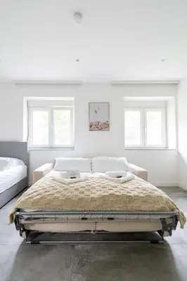 Ein Bett oder Betten in einem Zimmer der Unterkunft COY Apartments Purkersdorf - Garden Comfort for Work Family near Vienna