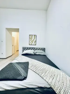 Ein Bett oder Betten in einem Zimmer der Unterkunft Studio with Kitchen, 7 Minutes from Ottakring