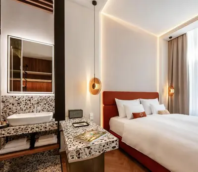 Ein Bett oder Betten in einem Zimmer der Unterkunft LOVIS Suites Vienna