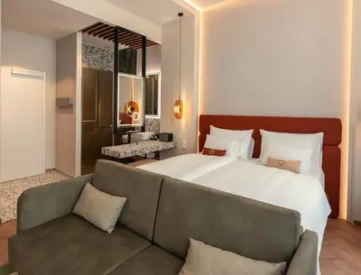 Ein Bett oder Betten in einem Zimmer der Unterkunft LOVIS Suites Vienna
