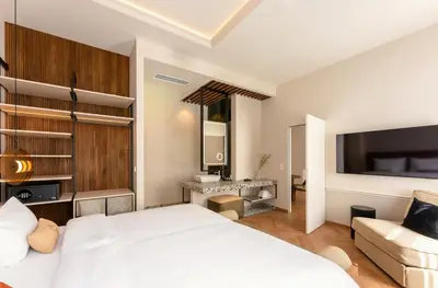 Ein Bett oder Betten in einem Zimmer der Unterkunft LOVIS Suites Vienna