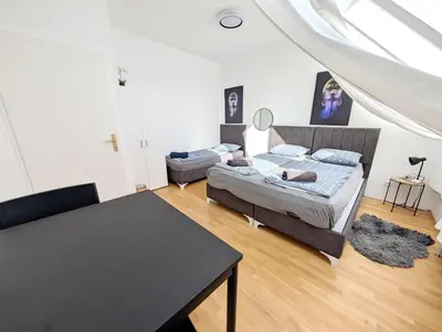 Ein Bett oder Betten in einem Zimmer der Unterkunft Lovely Rooms in Märzstraße Area MZ49